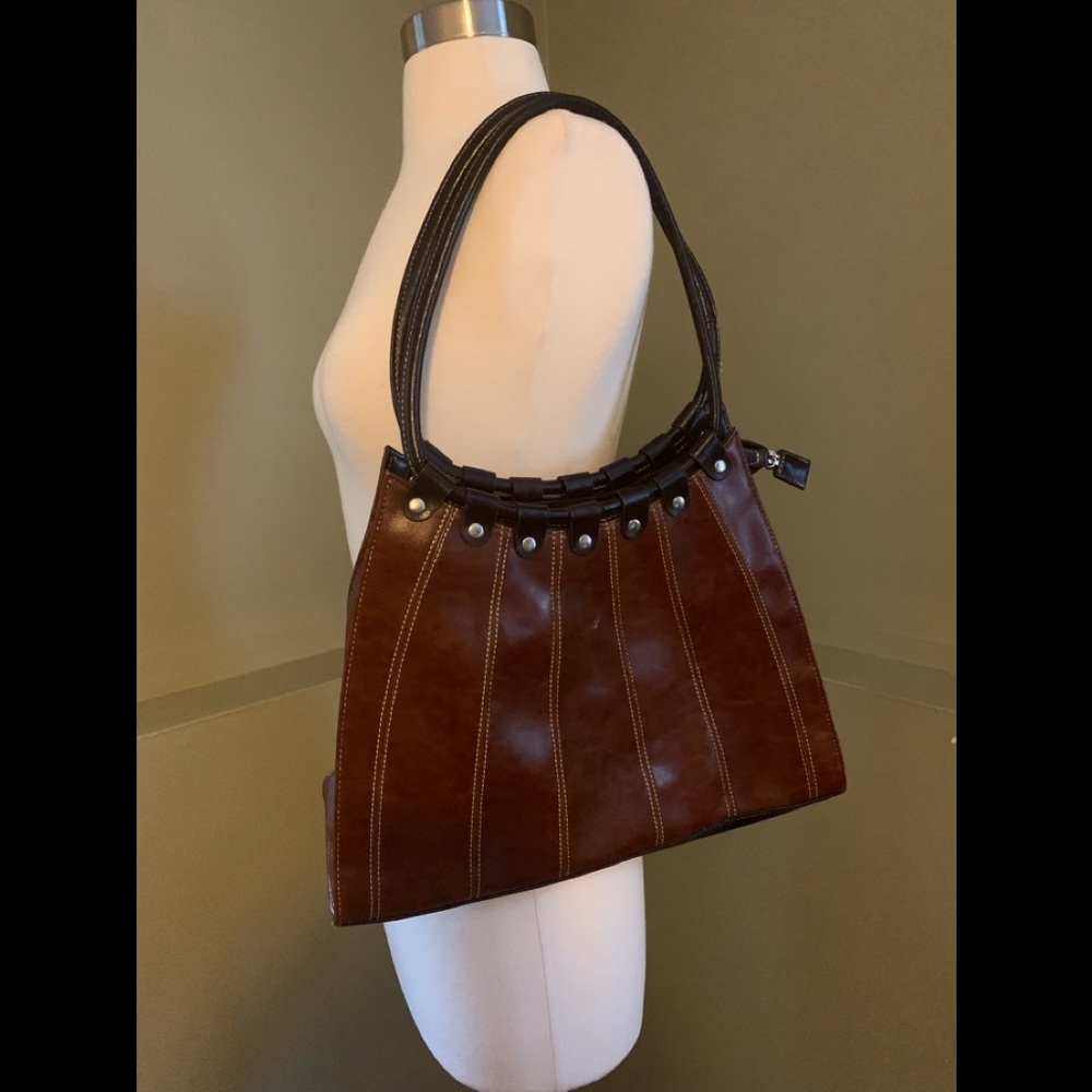 Dark brown purse black handles.  Like new